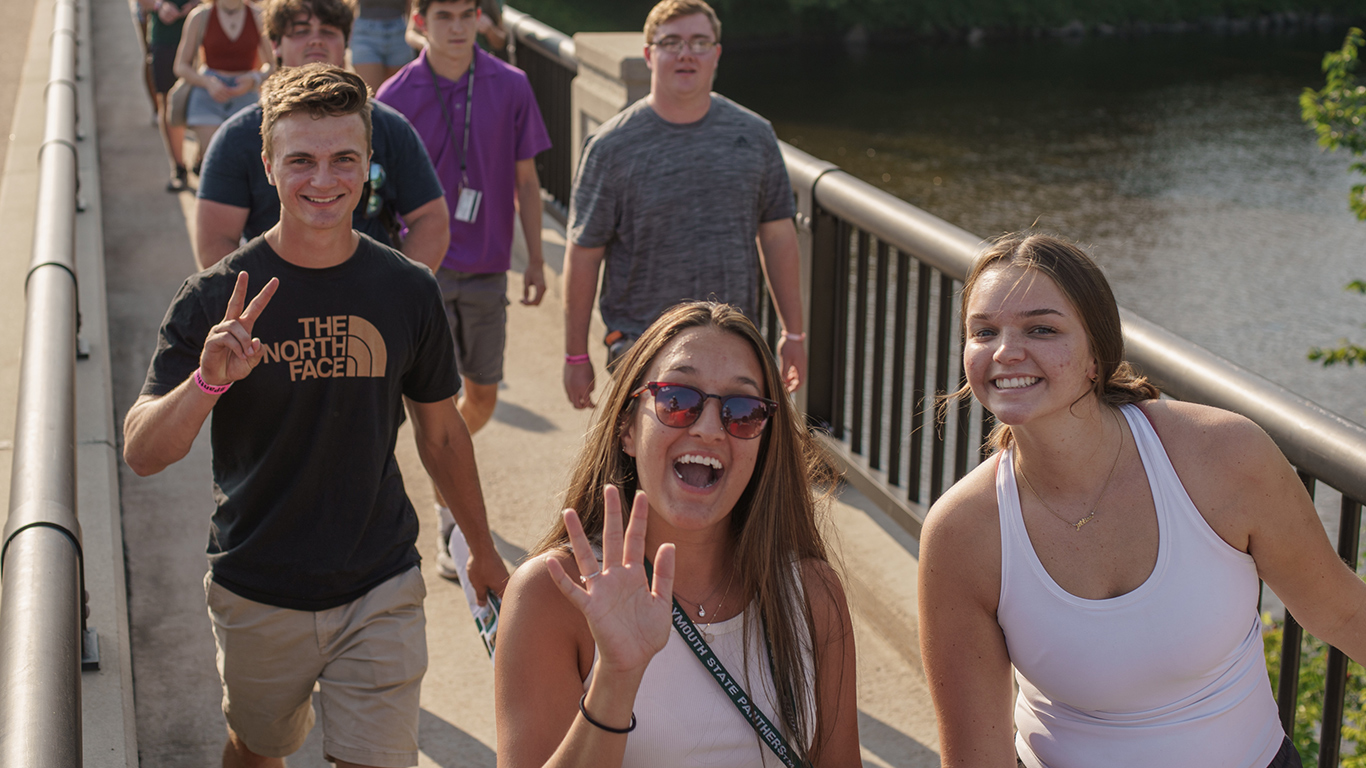 Students walking across bridge