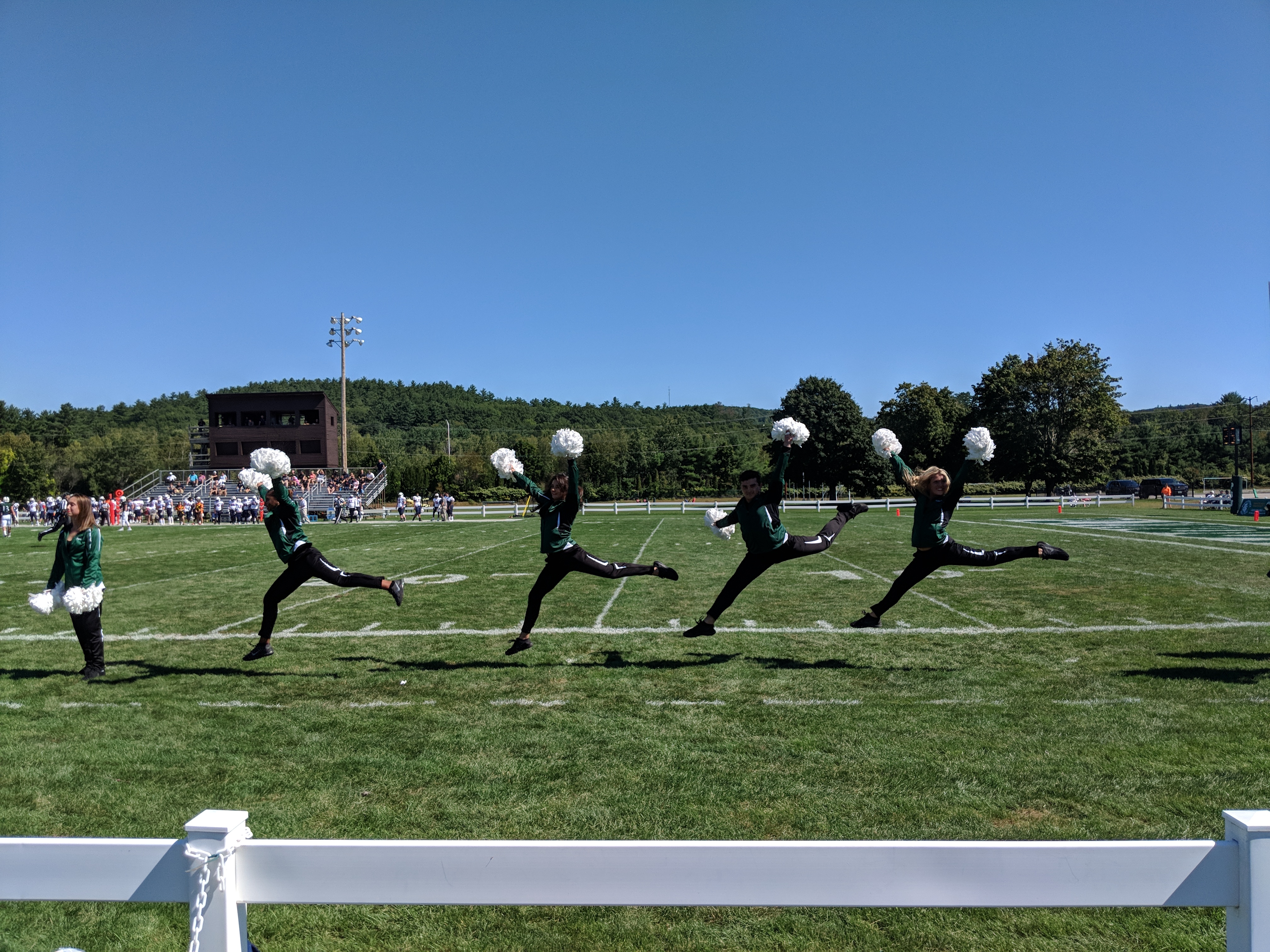 Plymouth State Dance Team performing on the sidelines