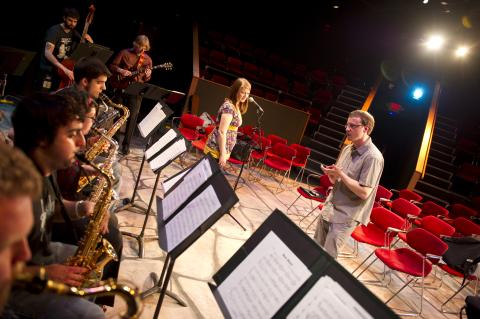 Students in band class playing instruments