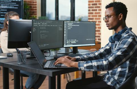 A man using a cybersecurity computer.