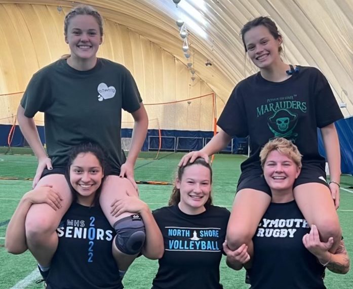 Women's rugby engaged in comrodery ft Eli